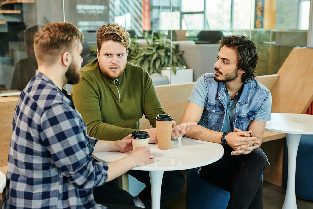 Three men talking to each other