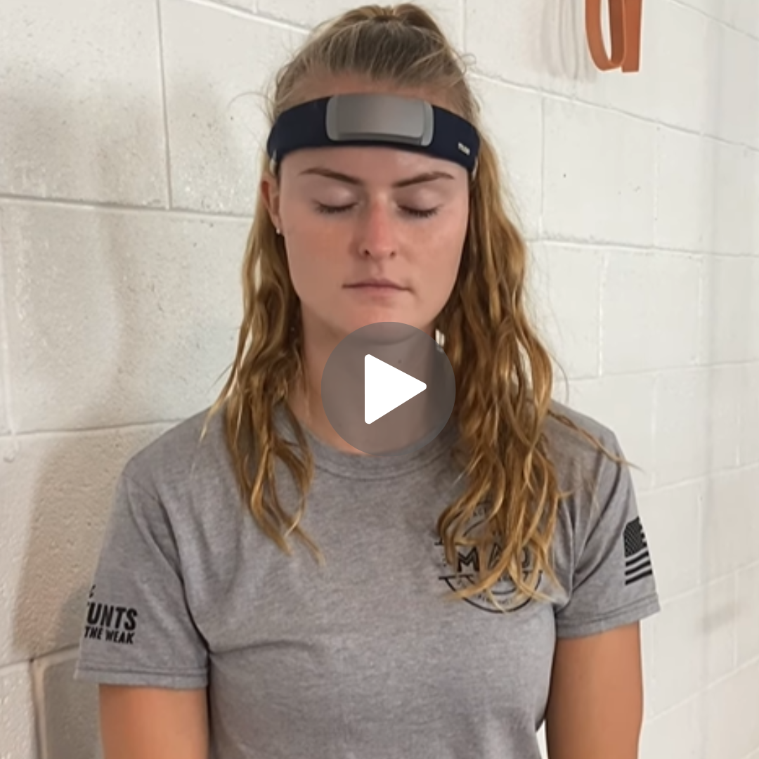 Kimberley Benson balances at the edge of a 20-meter diving platform, embodying calm focus trained through Muse neurofeedback.
